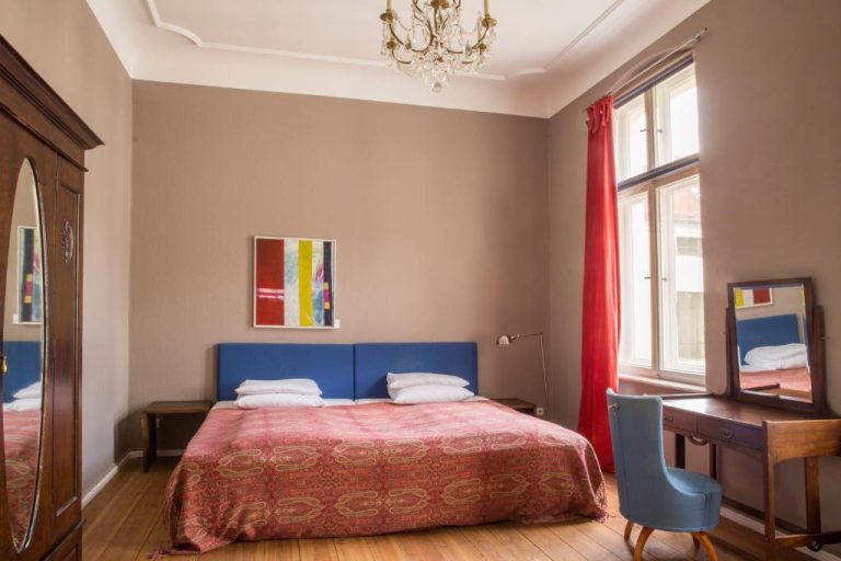 a bedroom with a blue bed and a desk at Hotel Art Nouveau am Kurfurstendamm in Berlin 768x512