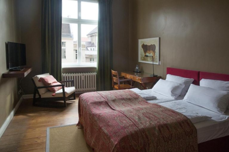 a bedroom with a large bed and a window at Hotel Art Nouveau am Kurfurstendamm in Berlin 768x512