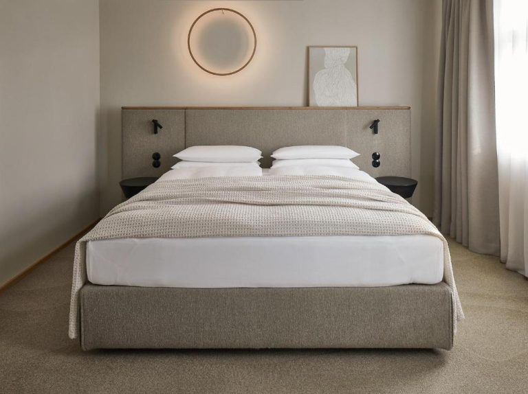 a bedroom with a large bed in a room at ADELANTE Boutique Hotel in Berlin 768x574