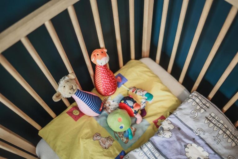 a crib with some stuffed animals in it at The Circus Apartments in Berlin 768x512