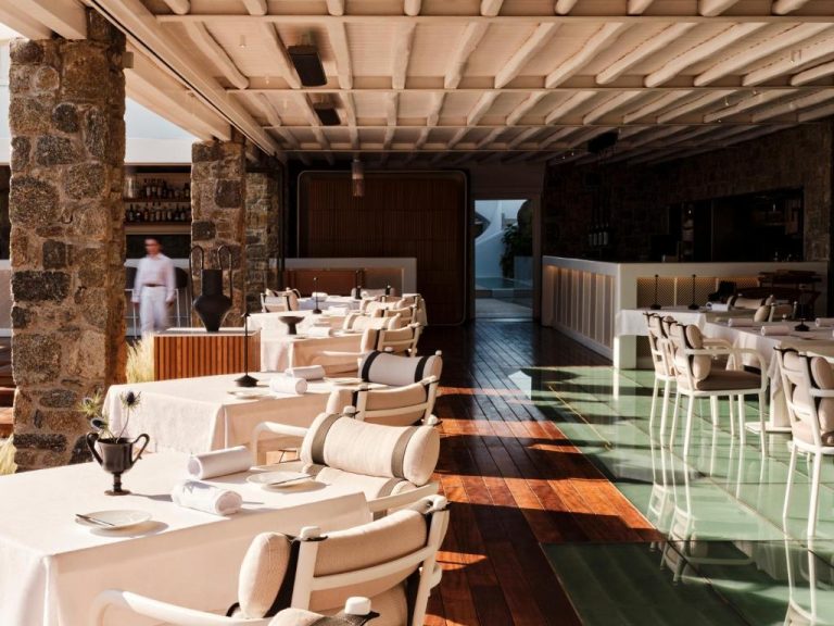 a dining room with white tables and chairs at BillCoo Mykonos The Leading Hotels of the World in Mikonos 768x576