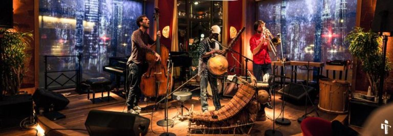 a group of people standing in a recording room at Orania.Berlin in Berlin 768x266