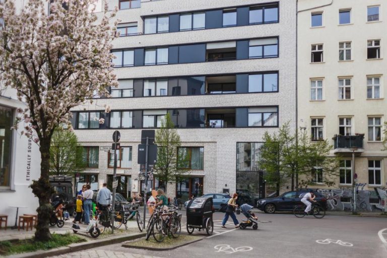 a group of people standing in front of a building at The Circus Apartments in Berlin 768x512