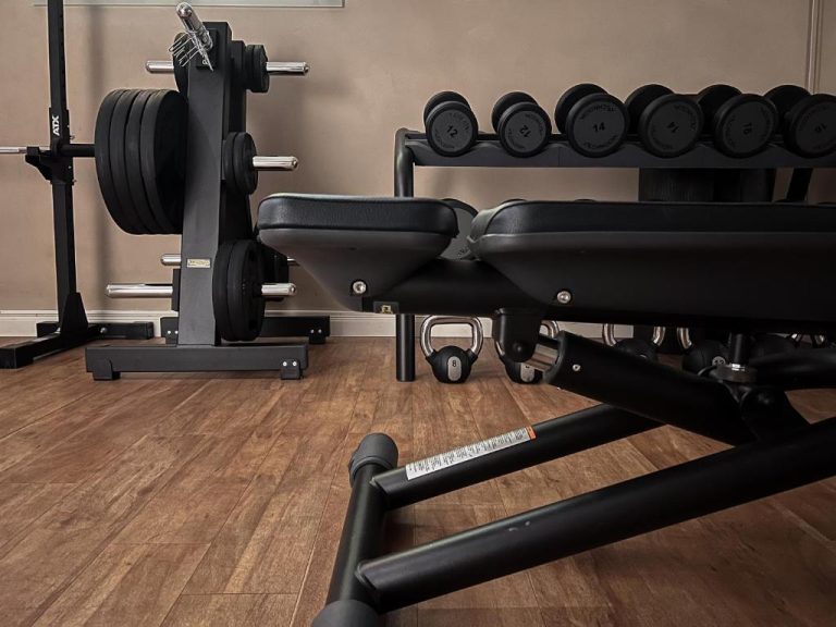 a gym with a bench and other equipment at ADELANTE Boutique Hotel in Berlin 768x576