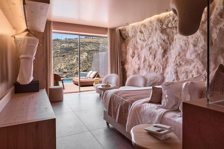 a hotel room with a bed and a view at Ethereum Luxury Suites a member of Mykonos Highlights in Mikonos 768x512