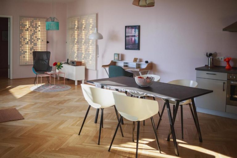 a kitchen and dining room with a table and chairs at The Circus Apartments in Berlin 768x512