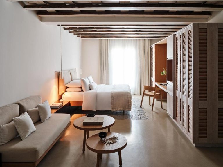 a living room with a couch and a bed at BillCoo Mykonos The Leading Hotels of the World in Mikonos 768x576