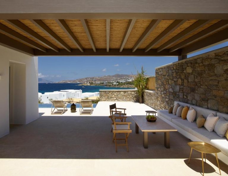 a living room with a couch and a table at Bonzoe Suites Villas in Mikonos 768x593