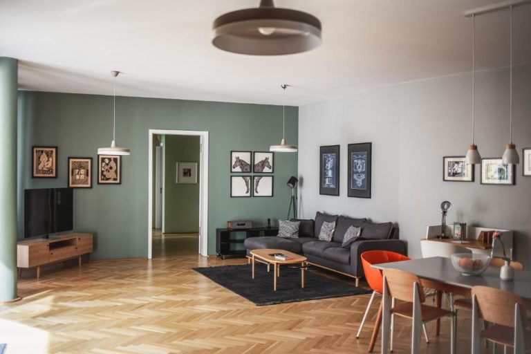 a living room with a couch and a table at The Circus Apartments in Berlin 768x512