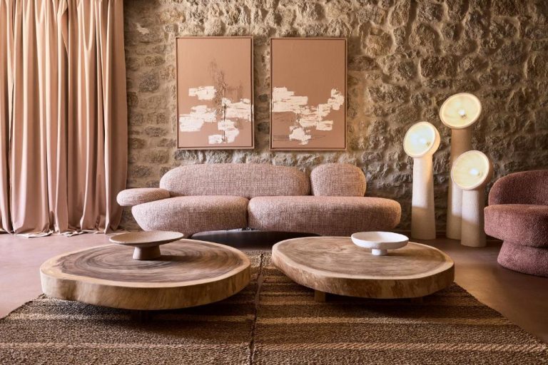 a living room with a couch and two tables at Ethereum Luxury Suites a member of Mykonos Highlights in Mikonos 768x512