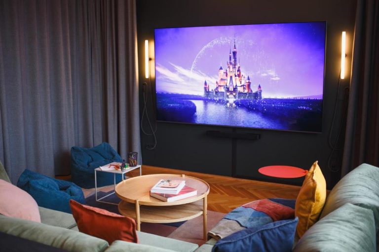 a living room with a flat screen tv on a wall at The Circus Apartments in Berlin 768x512