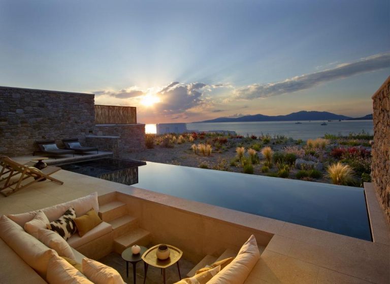 a living room with a view of the water at Bonzoe Suites Villas in Mikonos 768x558