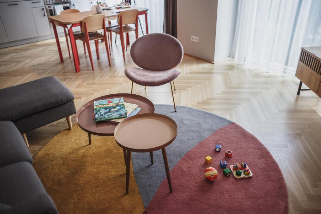 a living room with two chairs and a table at The Circus Apartments in Berlin