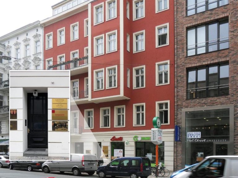a red building with cars parked in front of it at Boutique Hotel Mittendrin Berlin in Berlin 768x576