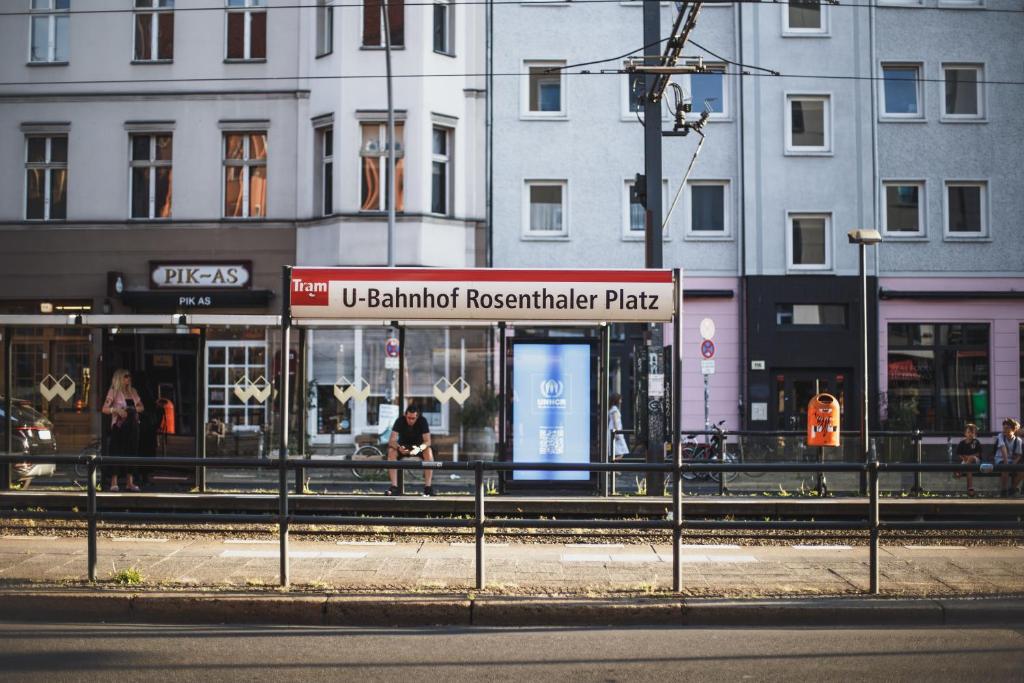 a store on the side of a street with buildings at The Circus Apartments in Berlin