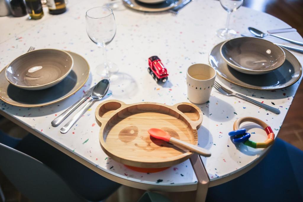 a table with a plate with a toy car on it at The Circus Apartments in Berlin