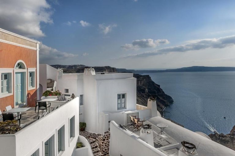 a view of the ocean from the balcony of a house at Aigialos Luxury Traditional Settlement in Fira 768x512