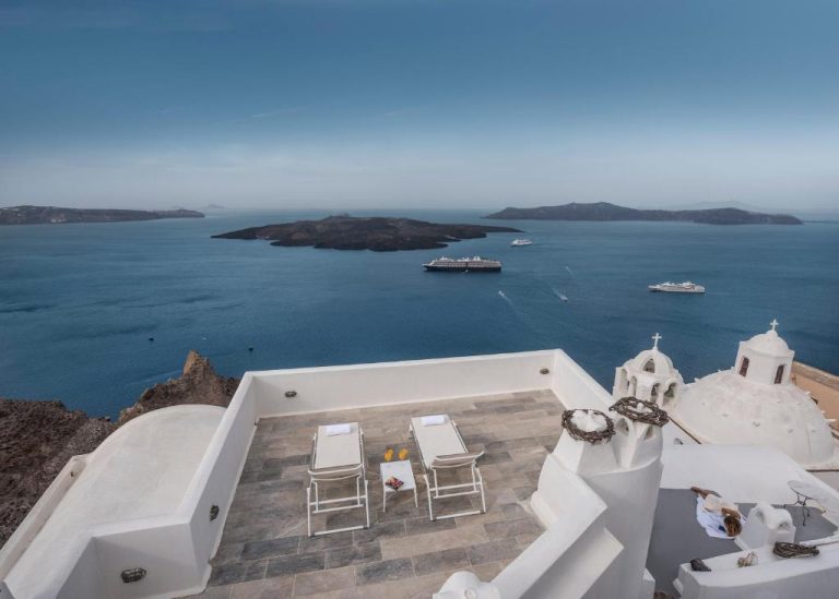 a view of the ocean from the top of a building at Aigialos Luxury Traditional Settlement in Fira 768x549