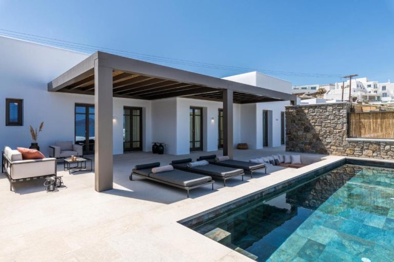 a villa with a swimming pool and a house at Bonzoe Suites Villas in Mikonos 768x512