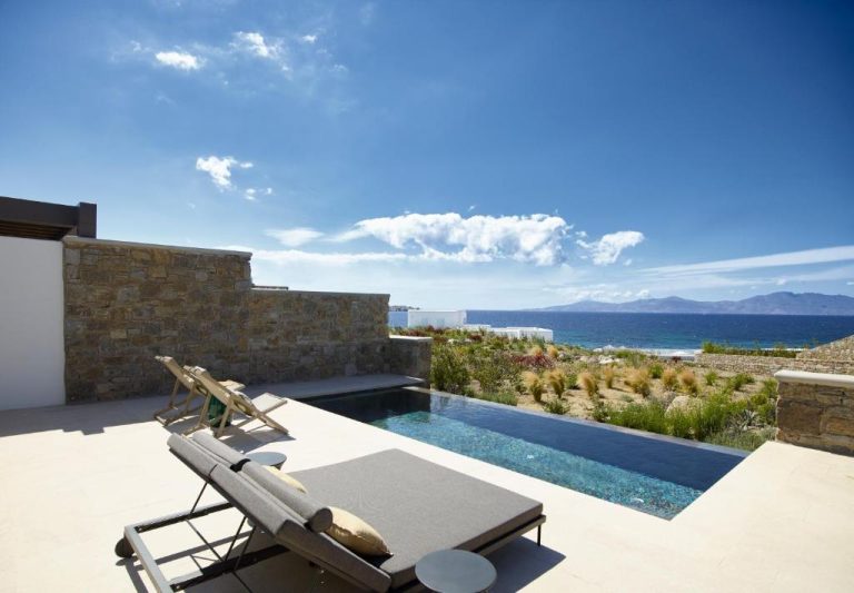 a villa with a swimming pool and a view of the ocean at Bonzoe Suites Villas in Mikonos 768x533