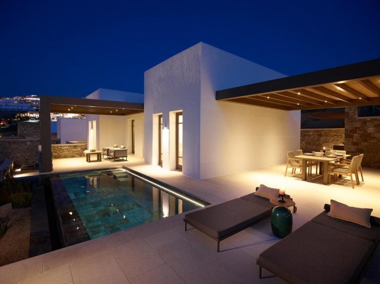 a villa with a swimming pool at night at Bonzoe Suites Villas in Mikonos 1 768x575