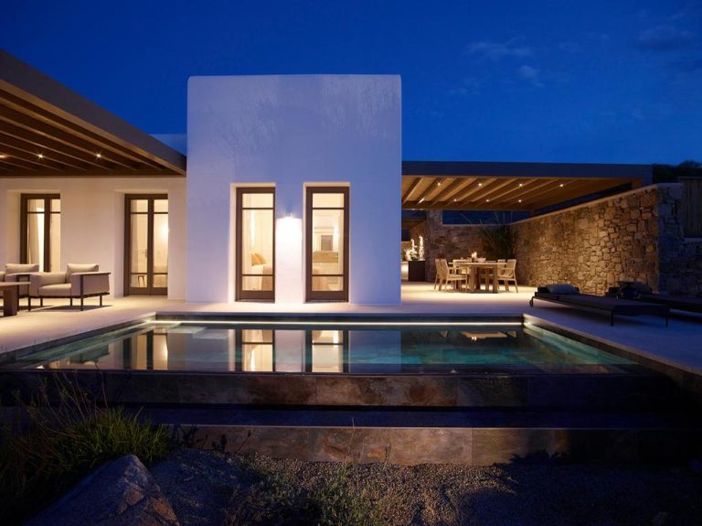 a villa with a swimming pool at night at Bonzoe Suites Villas in Mikonos 2 768x575