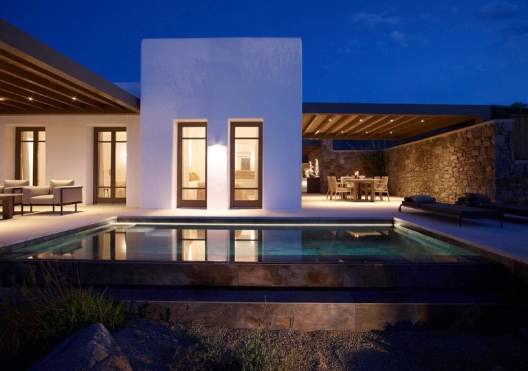 a villa with a swimming pool at night at Bonzoe Suites Villas in Mikonos 3 768x540