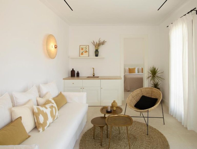 a white living room with a white couch and chairs at Bonzoe Suites Villas in Mikonos 768x582