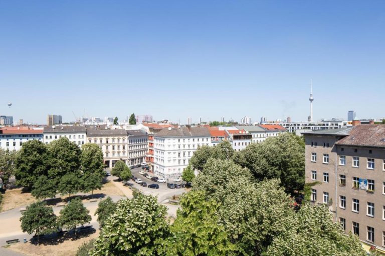 an aerial view of a city with buildings and trees at Orania.Berlin in Berlin 768x512