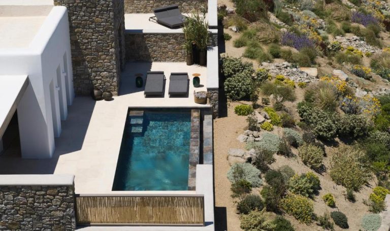 an aerial view of a villa with a swimming pool at Bonzoe Suites Villas in Mikonos 768x455