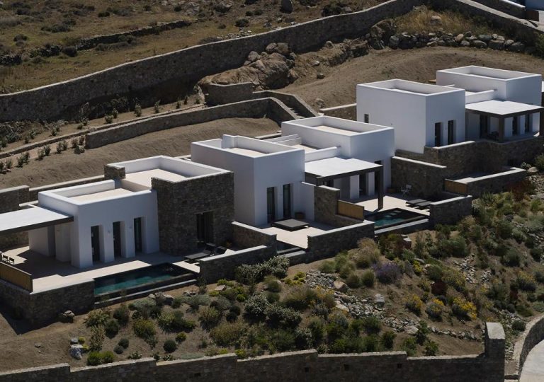 an aerial view of a white building on a hill at Bonzoe Suites Villas in Mikonos 768x540