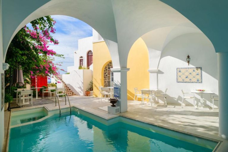 an external view of a swimming pool in a house at Aigialos Luxury Traditional Settlement in Fira 768x512